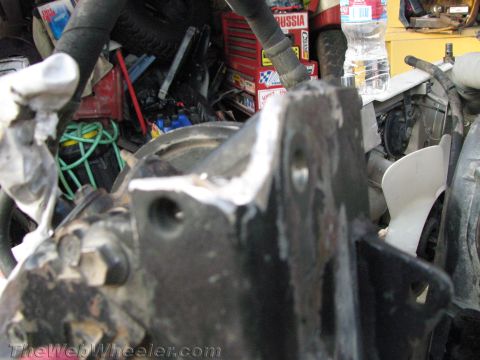 1987 Suzuki Samurai - A close-up view of a metal engine component, showing its construction and mounting points.