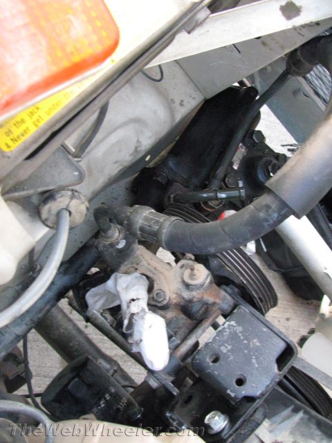 1987 Suzuki Samurai - Close-up view of the power steering system components within the engine bay.