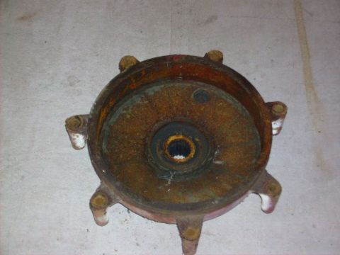 2000 Ford E350 - This heavily rusted metal component appears to be a part from a vehicle, possibly a hub or similar assembly.