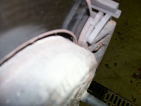 2001 Ford Crown Victoria - Detail of a vehicle's exhaust system, showing the muffler and pipework.