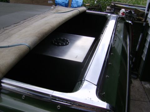 1970 Ford Ranchero - A custom fuel tank is installed in the bed of a pickup truck, partially covered by a tarp.