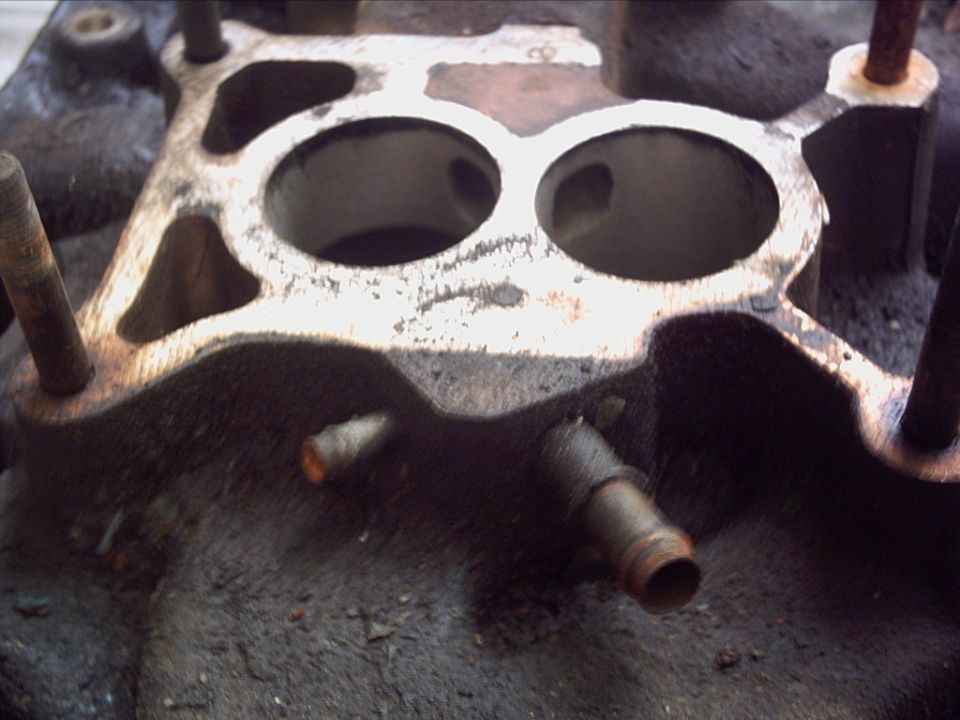 Intake manifold with two large ports and rusted studs