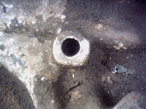 1979 Ford LTD - This is a close-up view of a dirty engine intake manifold part.
