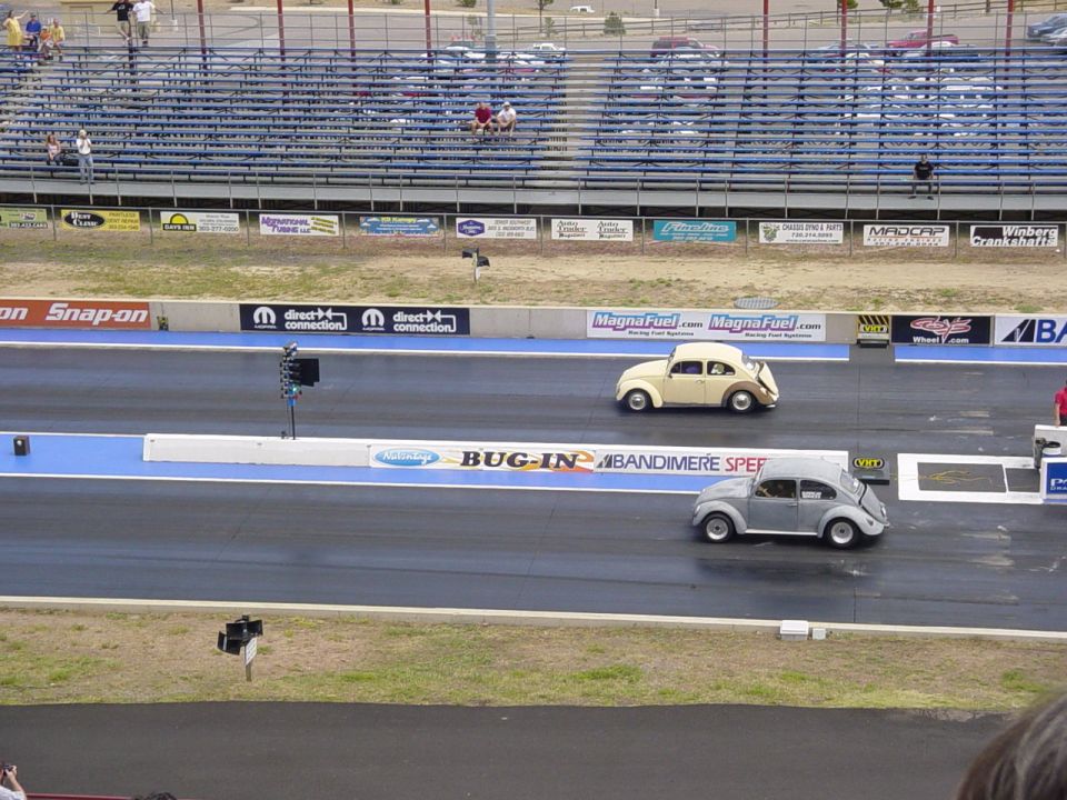 Cream and primer-gray VW Beetles staged on the drag strip at a Bug-In event, Bandimere Speedway