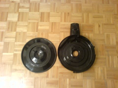 1985 Ford Bronco - Two black air cleaner housings are shown on a wood floor.
