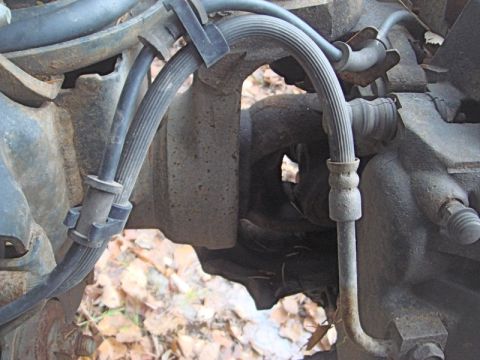 1996 Ford Bronco - This image shows a close-up view of brake lines and suspension components, not the exterior of a 1996 Ford Bronco.