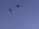 1988 Ford Bronco - An aircraft releases paratroopers into the sky during a jump.