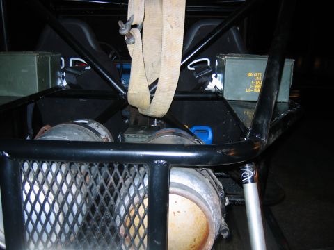 1992 Ford Mustang - The interior of a custom vehicle shows two seats, storage boxes, and safety straps.