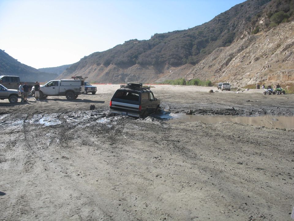 1987 Ford Bronco stuck in mud, rear view