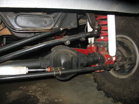1987 Ford Bronco - Close-up of the front axle and suspension system on a 1987 Ford Bronco.