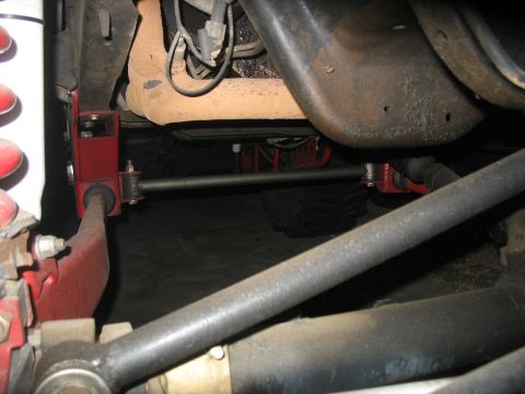 1987 Ford Bronco - Vehicle suspension and steering parts are visible in this close-up shot.