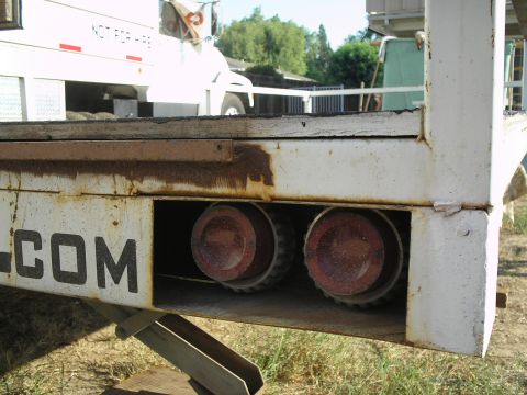 1990 Ford Bronco - Trailer lights and frame detail, with another vehicle visible in the background.