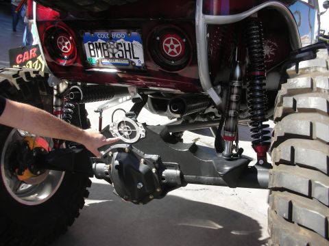1998 Ford Crown Victoria - Underbody rear view of a lifted truck showing a heavy differential, dual shocks, exhaust and a Colorado license plate above subwoofer grill…