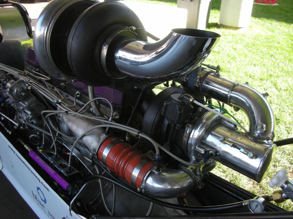 Close-up of turbocharger and intercooler plumbing on a dragster engine