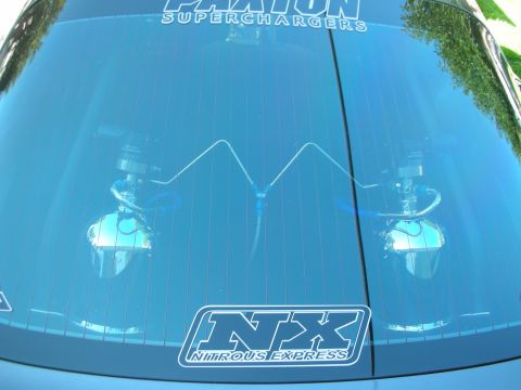 1998 Ford Crown Victoria - pinstriped blue hood displaying twin polished nitrous bottles under clear panels with Paxton Superchargers and NX Nitrous Express decals.