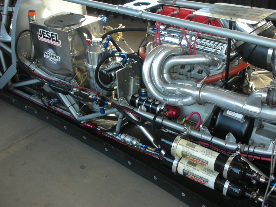 Detailed drag car engine bay with Jesel components, headers and nitrous bottles