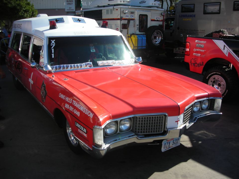 Red and white converted ambulance station wagon with Chino Hills Transmission lettering
