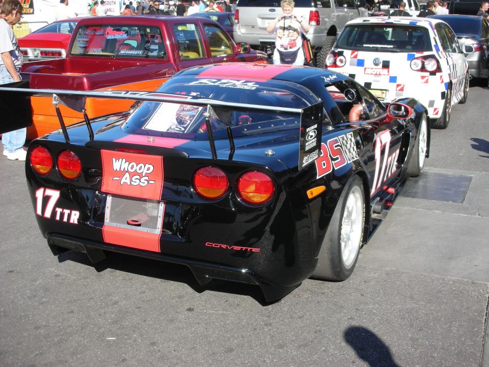 Black and red Chevrolet Corvette race car number 17 TTR with Whoop Ass rear graphic