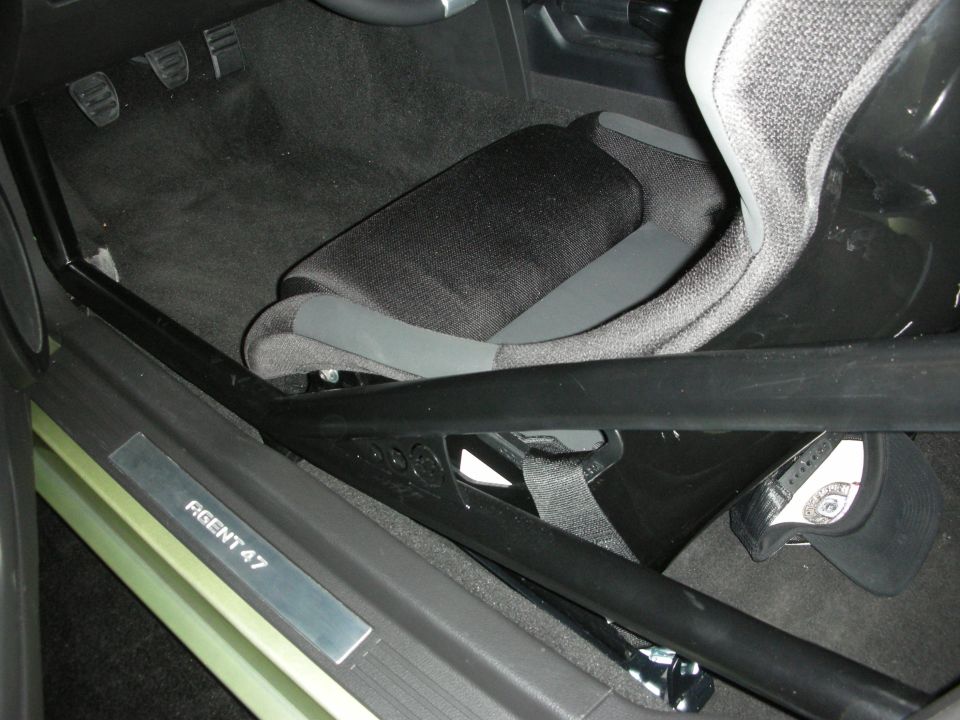 Car footwell with bucket seat, pedals, roll bar, and 'Agent 47' door sill