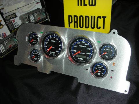 1998 Ford Crown Victoria - aluminum dash insert outfitted with black-faced Cobalt RPM, MPH and accessory gauges shown next to a yellow New Product sign.