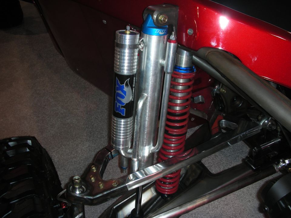 Off-road suspension detail with Fox bypass shock, coilover and chromoly control arm