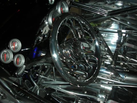 1998 Ford Crown Victoria - Polished chrome steering wheel and a bank of small round gauges mounted in a highly polished tubular chassis.