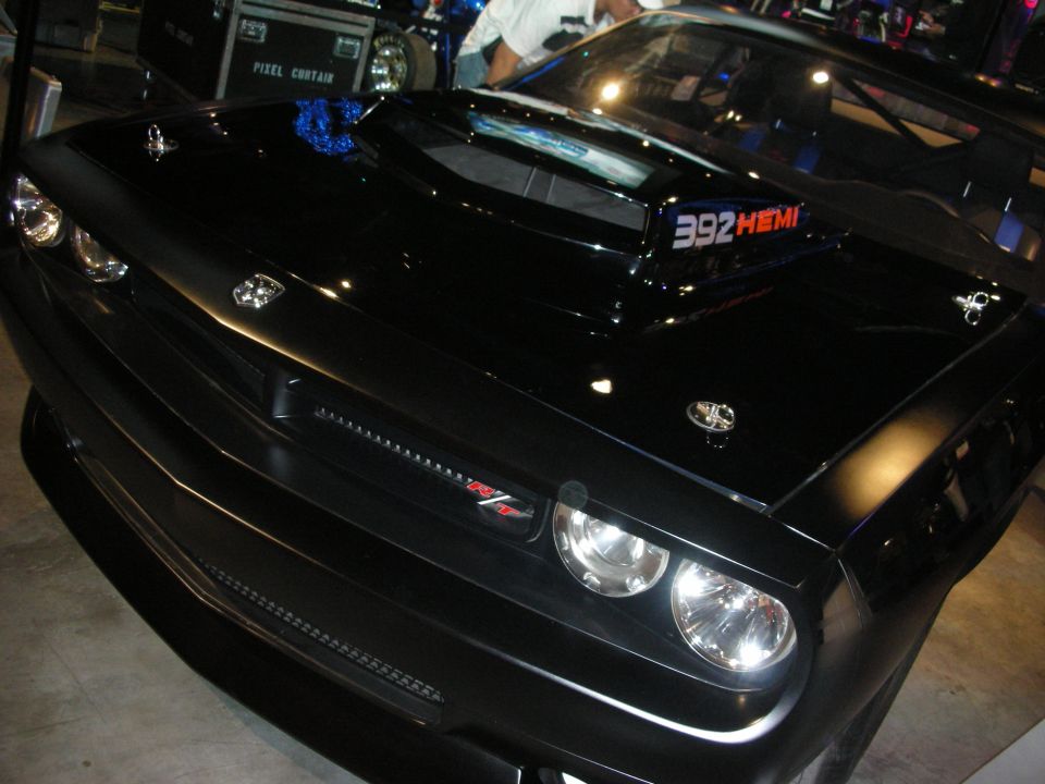 Close-up of black Dodge Challenger front and hood scoop badged 392 HEMI and R/T