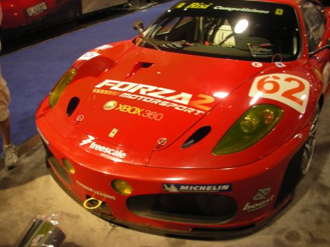 1998 Ford Crown Victoria - Front view of a red Ferrari GT race car wearing Forza Motorsport 2 Xbox 360 livery and the number 62.