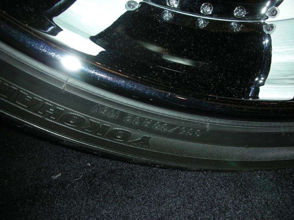 Close-up of Yokohama tire sidewall on a polished chrome wheel