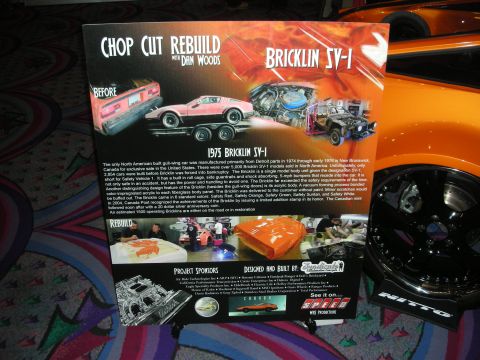 1998 Ford Crown Victoria - Photo of a Chop Cut Rebuild project display poster for a 1975 Bricklin SV-1 (gull-wing acrylic-body safety car) at a car show, listing buil…