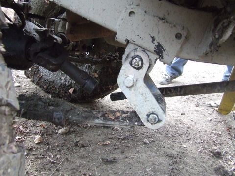 1990 Ford Bronco - Undercarriage view shows the front axle, driveshaft, and suspension components of a vehicle.