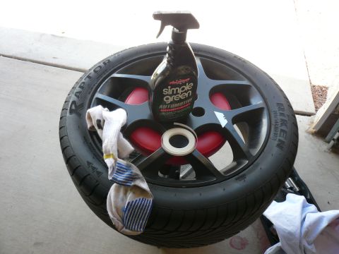 1996 Ford Probe - A car wheel, a bottle of Simple Green, and a sock are arranged on the ground.