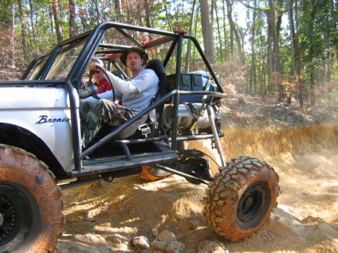 1992 Ford Mustang - Custom off-road buggy navigates a challenging dirt trail with two occupants.