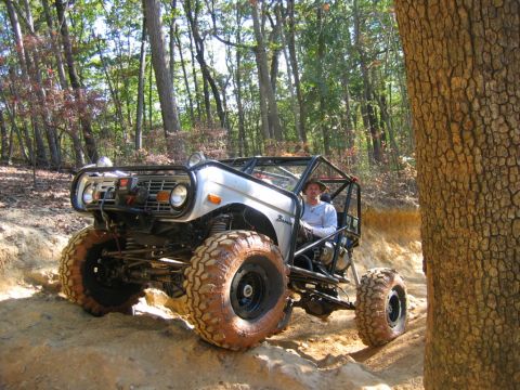1992 Ford Mustang - This modified Bronco is navigating a challenging off-road course, its capabilities.