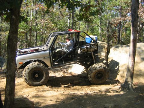 1992 Ford Mustang - This heavily modified Ford Bronco is navigating a challenging off-road course.