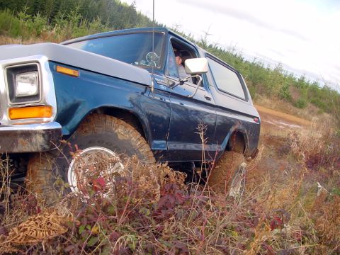 1979 Ford Bronco - Ford Bronco navigating rough terrain off-road.
