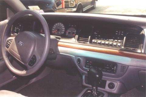 2002 Ford Crown Victoria - Interior view of a 2002 Ford Crown Victoria, showing the dashboard, steering wheel, and center console.