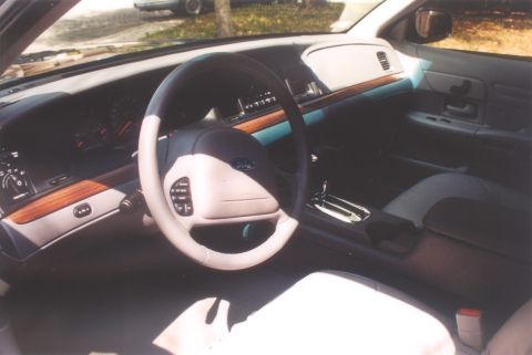 2002 Ford Crown Victoria - Interior view of a 2002 Ford Crown Victoria, highlighting the dashboard and driver's area.