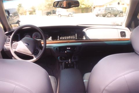 2002 Ford Crown Victoria - View from the back seat of a 2002 Ford Crown Victoria, looking forward at the dashboard and steering wheel.