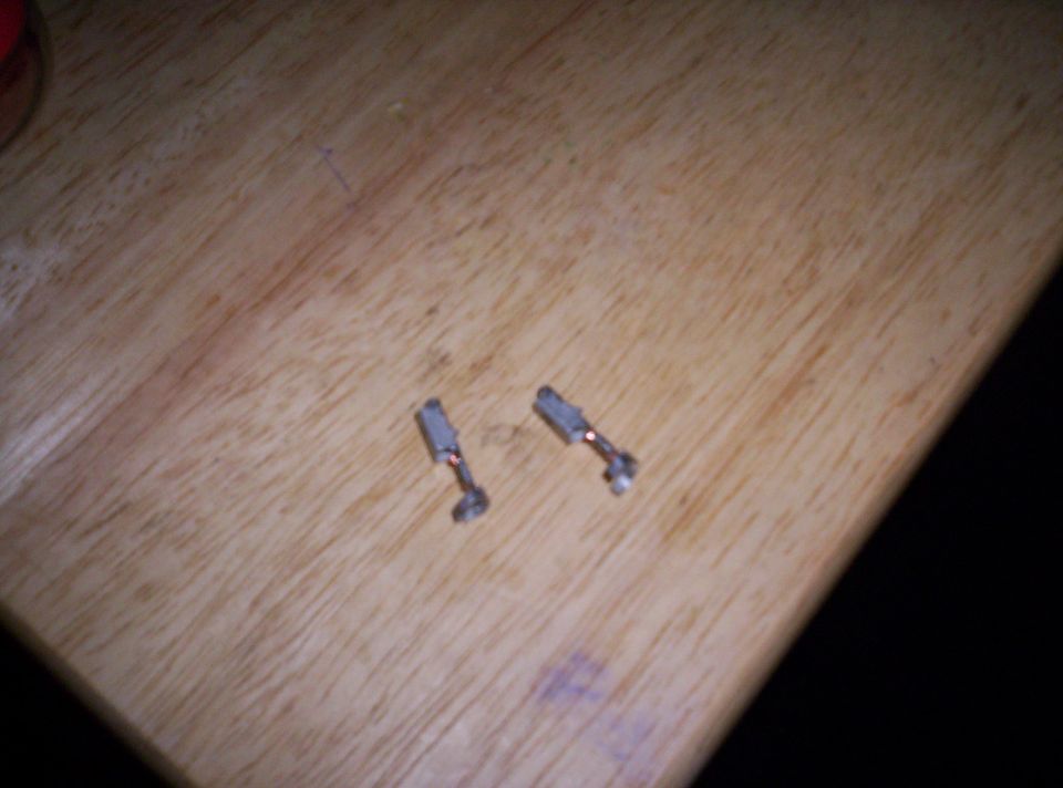 bulb connects removed from headlight connector with wires cut