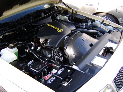 1996 Mercury Grand Marquis - Engine bay of a 1996 Mercury Grand Marquis, showing the V8 engine and associated components.