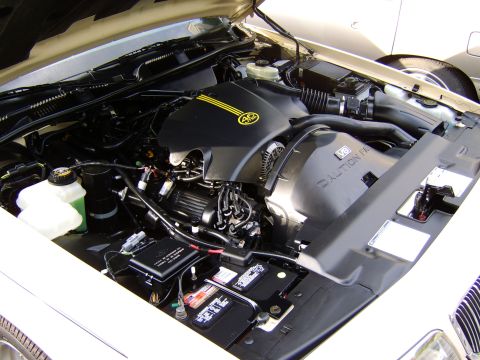 1996 Mercury Grand Marquis - The engine compartment of a 1996 Mercury Grand Marquis is displayed with the hood open, revealing the V8 engine.