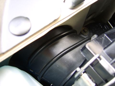 1996 Mercury Grand Marquis - Close-up view of a black engine air intake boot with ribbed texture.