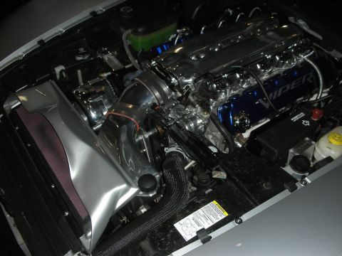 Engine bay with blue Viper valve covers, polished intake tube, and air filter