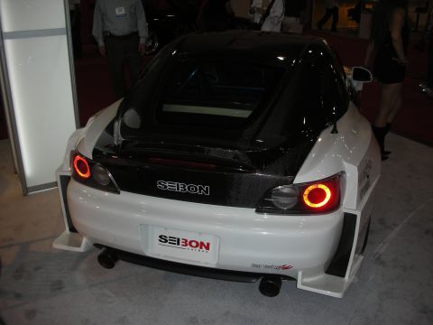 Rear of white Honda S2000 with carbon decklid and Seibon decal at show