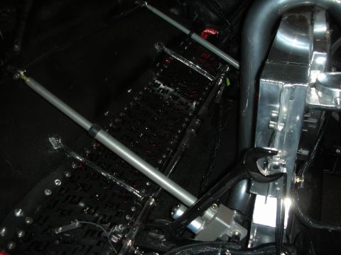 Underside detail of tube-frame chassis with suspension link and diamond plate