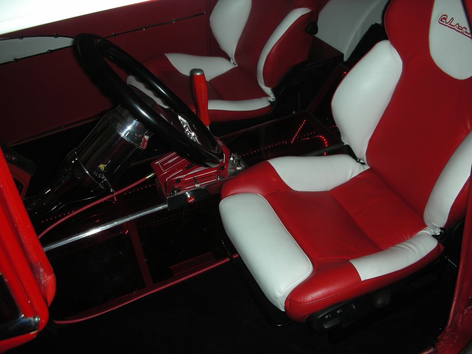Custom red and white leather interior with bomber-style seats and black wheel
