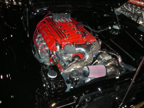 1998 Ford Crown Victoria - red Dodge 'Viper' V10 with a supercharger, chrome piping and cone filter installed in a glossy black engine bay.