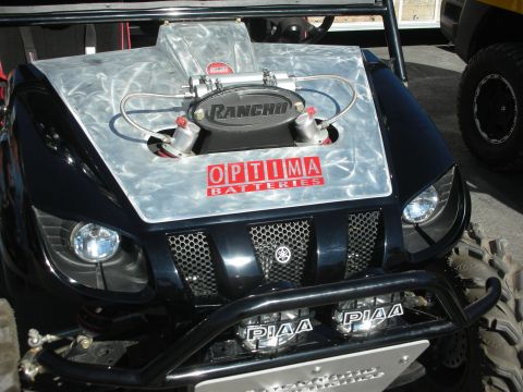 1998 Ford Crown Victoria - Front view of a black Yamaha side-by-side UTV with a polished metal hood, PIAA driving lights and a tubular bull bar.