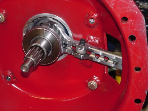 1979 Ford Bronco - Close-up view of a clutch fork mechanism, showing the splined shaft and bearing assembly.